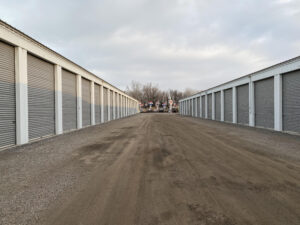 Picture of an aisle at lackside stoarge. The image shows several storage units on each side while showing the width of the aisle